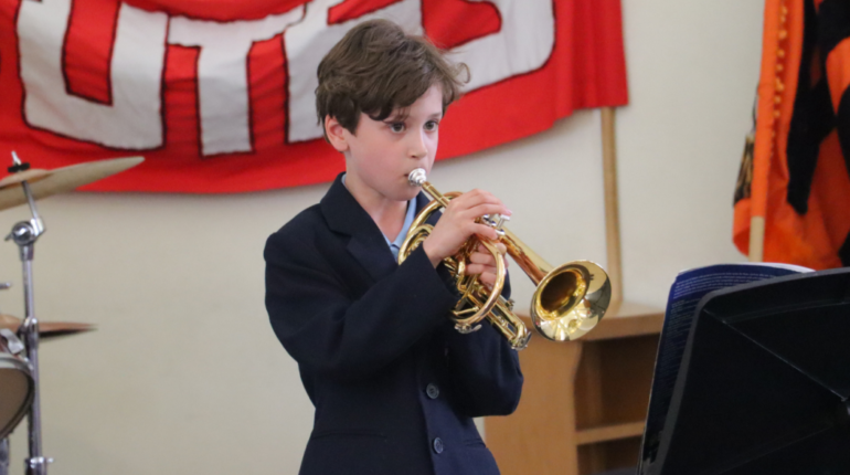 student playing the trumpet